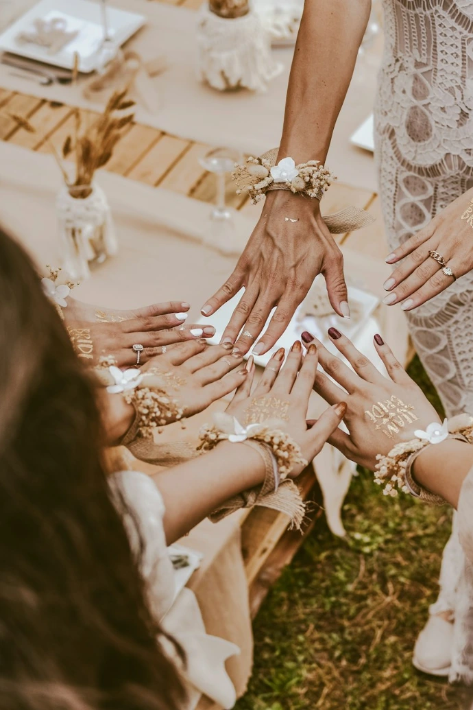 woman in white dress sitting on brown sand